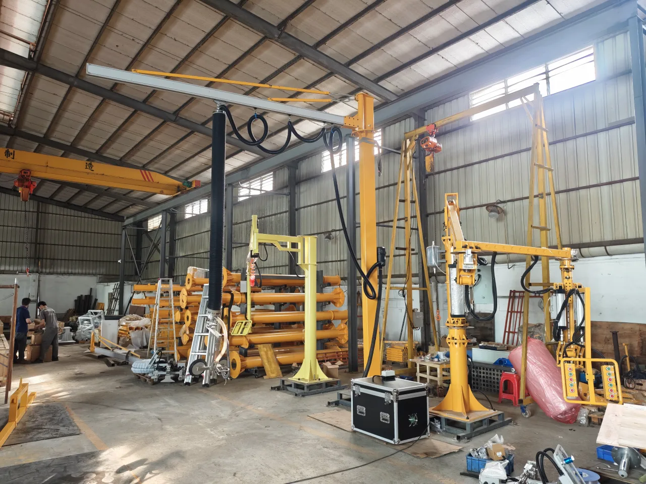 Vacuum tube lifters, lifting frames and supporting structures in a workshop